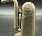 A nickel-plated brass Hawksley-type hearing aid in a compact, folded state. England, c.1880.