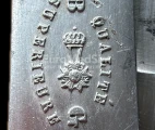 National Order of the Legion of Honour (French: Ordre national de la Légion d'honneur) engraved on the trade mark. B and G stand for Brene Guillaumot