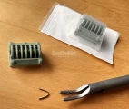 Clips in the sterile cartridges (green — ML size) are ready to be quickly loaded into the jaws of the clip-applier