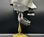 Columbia Dentoform's Phantom dental simulator, side view, placed on a brass rod on a stand. Photo: Maxim Gorshkov