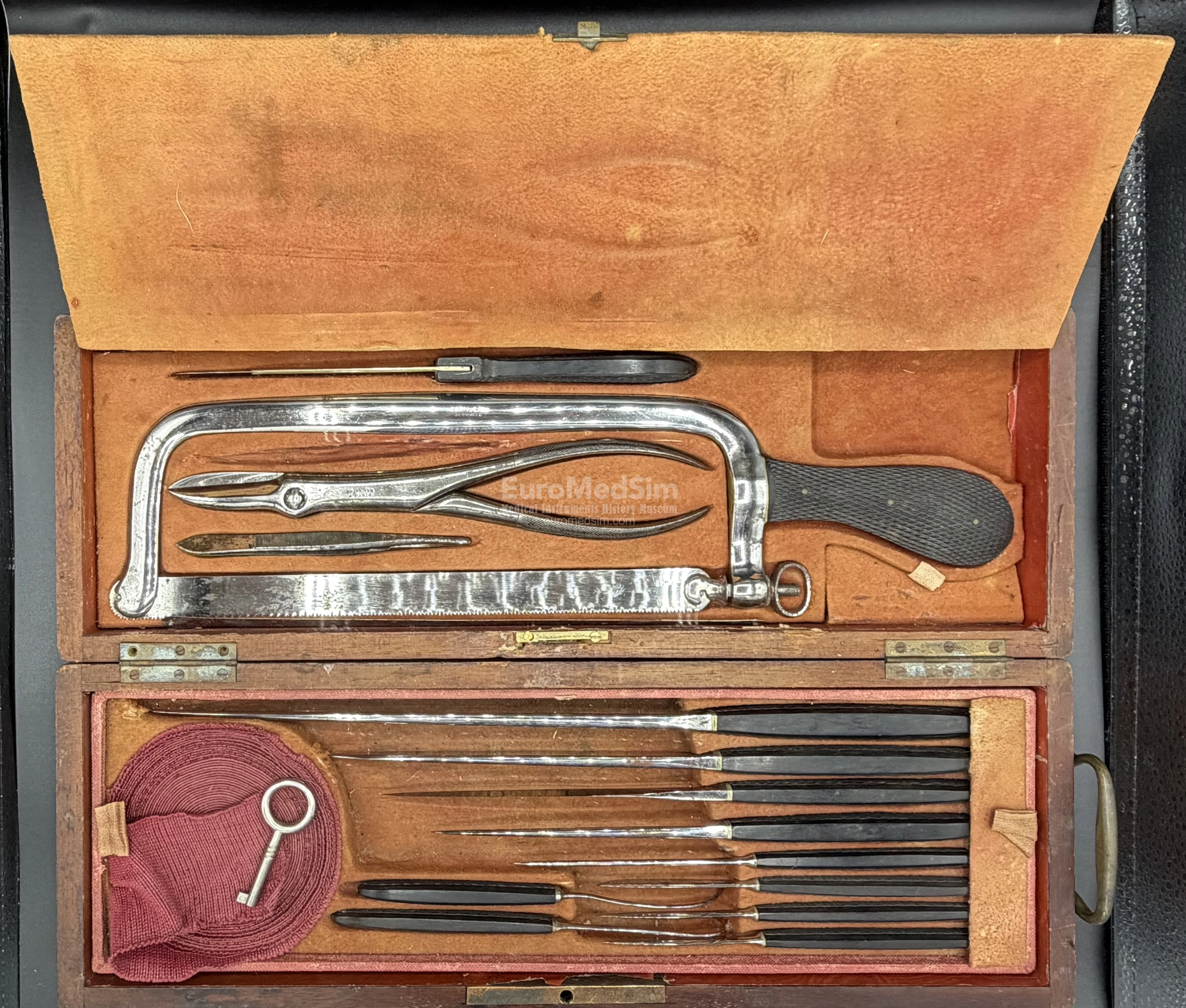 Lower compartment is opened. Amputation saws, pliers, knives and needles in the surgical cased set by Charriére á Paris/COLLIN & Cie, France, end of XIX c.