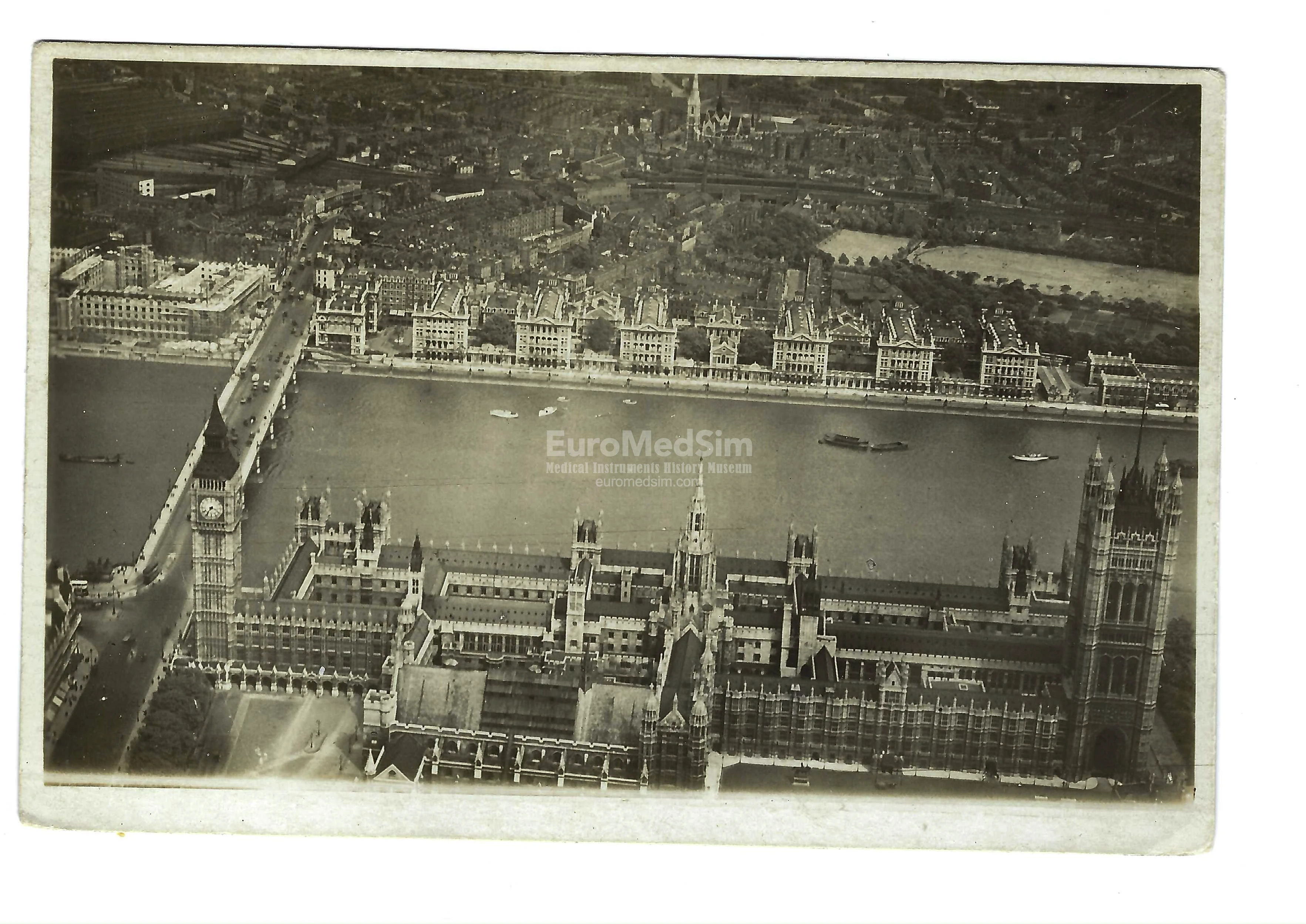 Aerial view of Houses of Parliament, Westminster Bridge and St Thomas Hospital, postcard c. 1919–1920. View recto