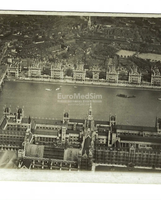 Aerial view of Houses of Parliament, Westminster Bridge and St Thomas Hospital, postcard c. 1919–1920. View recto