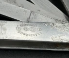 "Qualité superieure. B.G." engraving. Detail of the Art Nouveau aluminium scale of the vintage French multi-bladed fleam.