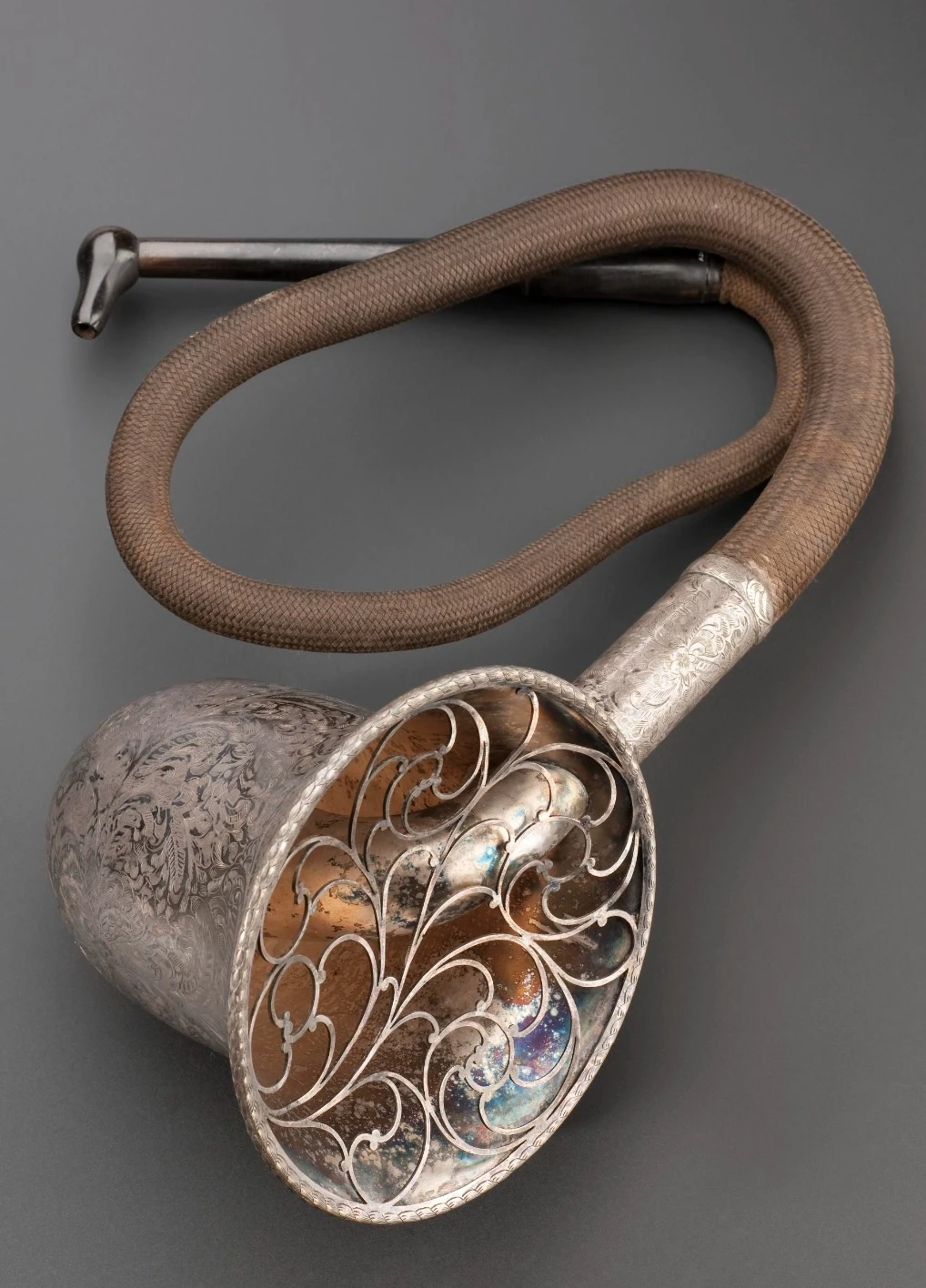 Conversation tube hearing aid, silver plated bras, bell diameter 14,6 cm, tube length 64 cm. F.C. Rein and Son, ca. 1880, London. Credit: Science Museum, London