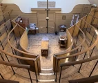 During the operations, the skylights served as the main source of light. The table is surrounded by a gallery with railings, forming rows of standing room for about 100 observers