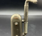 An extended earpiece tube, pointing away from the trumpet